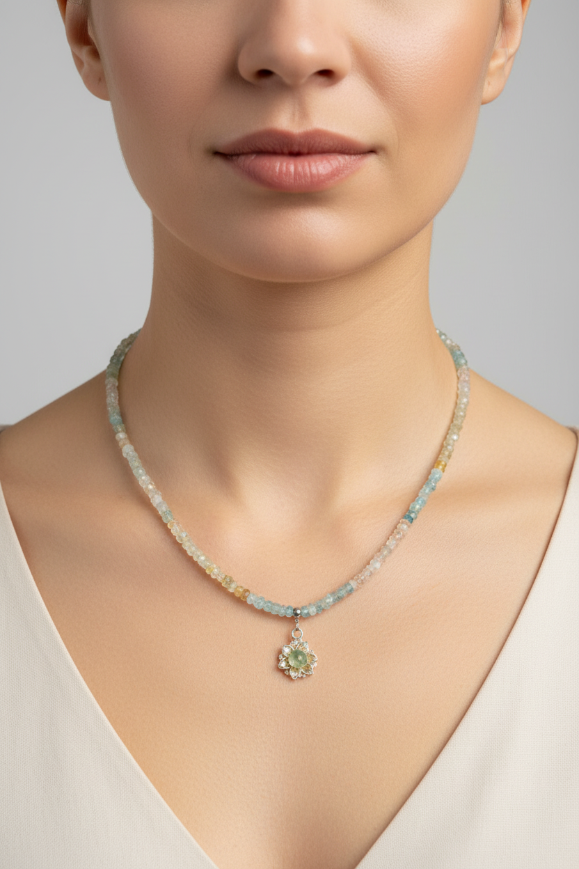 Beaded beryl necklace on a model with a flower charm