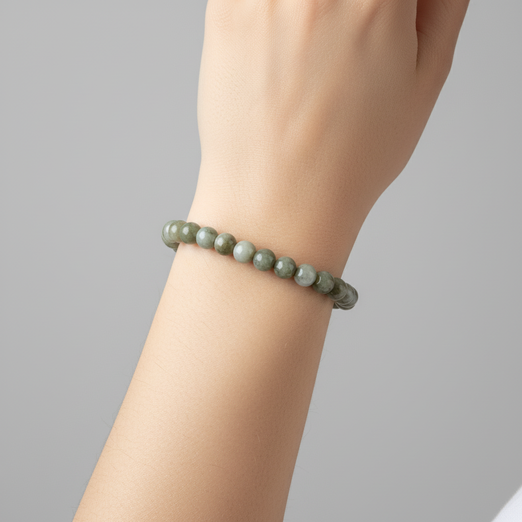 Bracelet on a model with a neutral background
