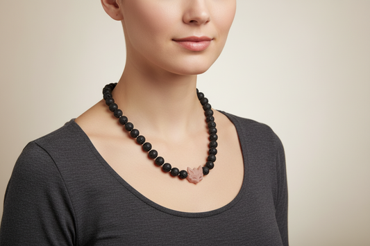Black beaded necklace with a wood fox pendant on a model