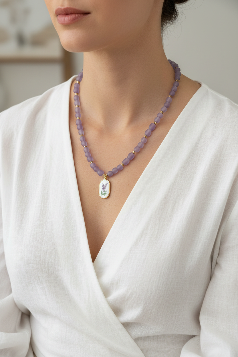 A purple african beaded necklace with a floral rectangular pendant on a model