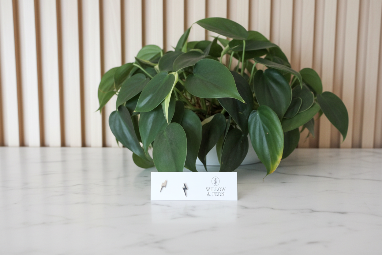 Silver lightning earrings on a white countertop