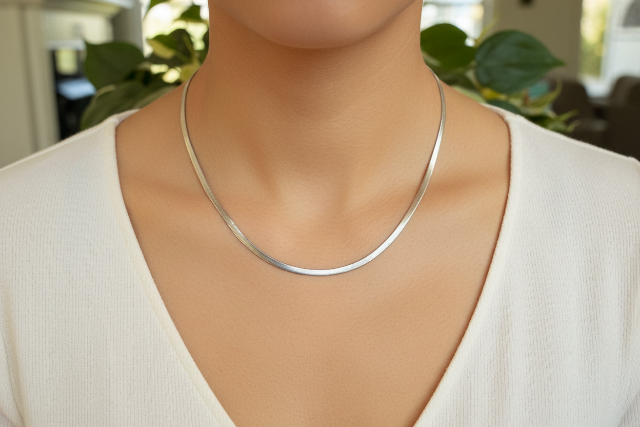 Silver herringbone chain necklace on a model
