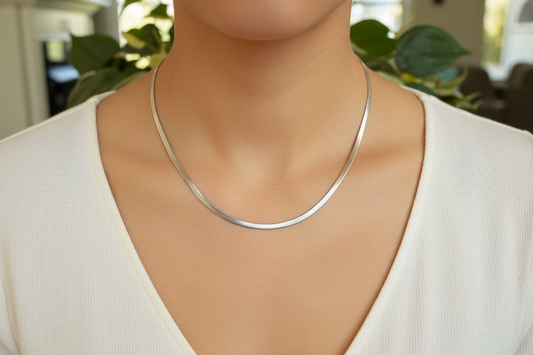 Silver herringbone chain necklace on a model