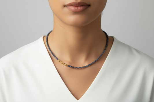 Sapphire necklace on a model with a neutral background